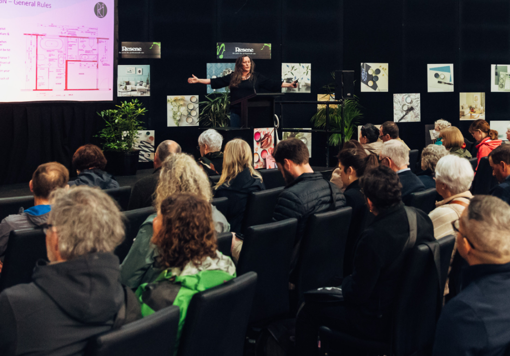 Visitors watching Kelly Gammie on Seminar Stage at the Auckland Home Show.